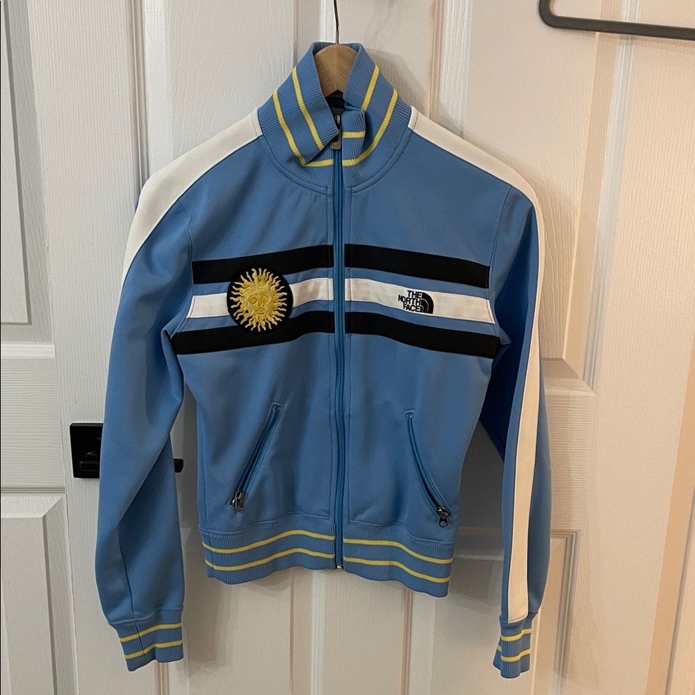 The North Face Light Blue Jacket with Black and White Stripes